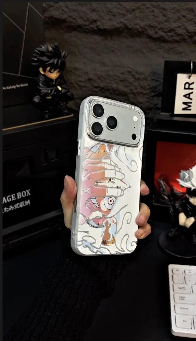 Close-up of the raised artwork on a pink and white anime case